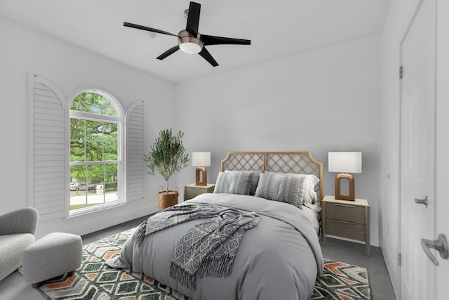 bedroom with baseboards, ceiling fan, and carpet