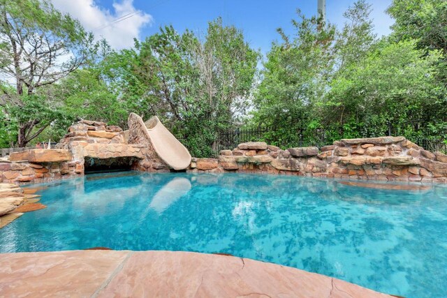 view of pool featuring a fenced in pool