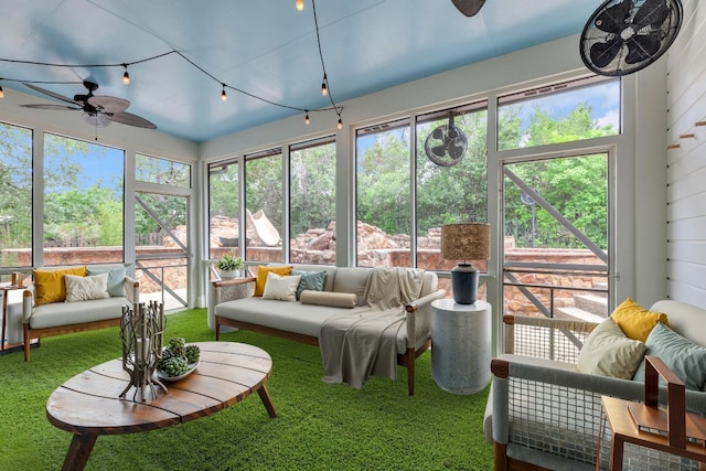 sunroom with an outdoor living space, ceiling fan, and a healthy amount of sunlight