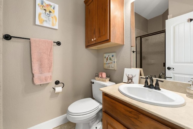 bathroom featuring vanity, baseboards, toilet, and a shower stall