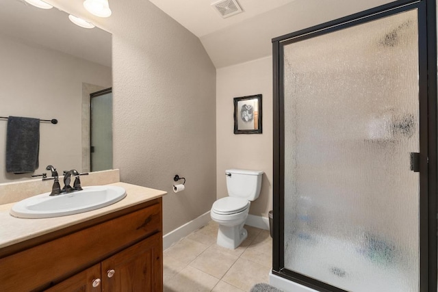 bathroom featuring visible vents, vanity, lofted ceiling, tile patterned floors, and a stall shower