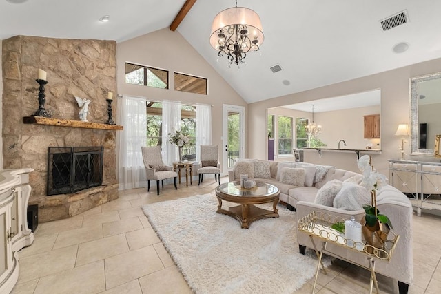 living room featuring high vaulted ceiling, a chandelier, a healthy amount of sunlight, beamed ceiling, and visible vents