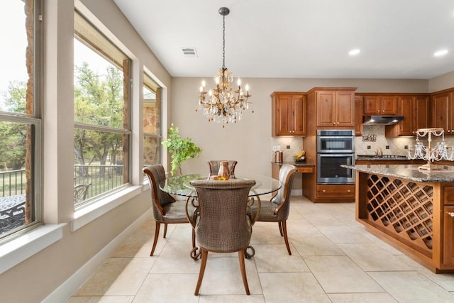 dining area with a notable chandelier, recessed lighting, baseboards, light tile patterned floors, and visible vents