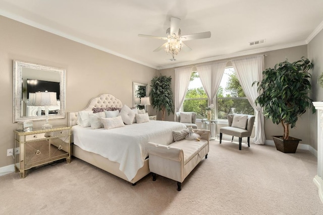 bedroom featuring visible vents, baseboards, crown molding, and light carpet