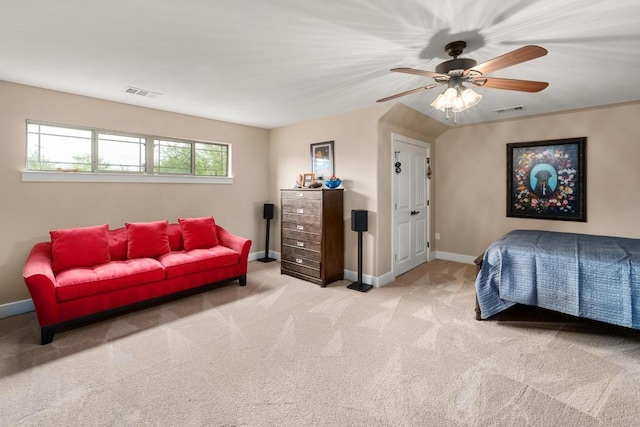carpeted bedroom with baseboards, visible vents, and ceiling fan