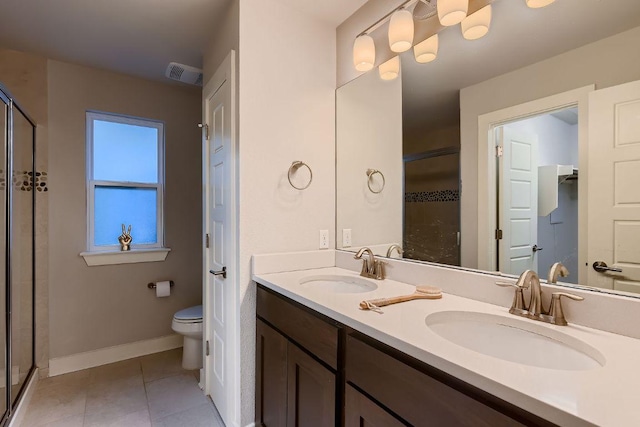 full bathroom with a sink, a stall shower, toilet, and visible vents