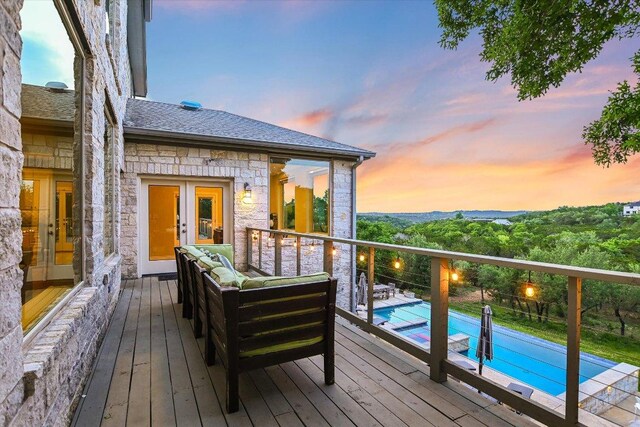 277 S Commons Ford Rd, Austin, TX 78733 - wooden deck with an outdoor living space and french doors