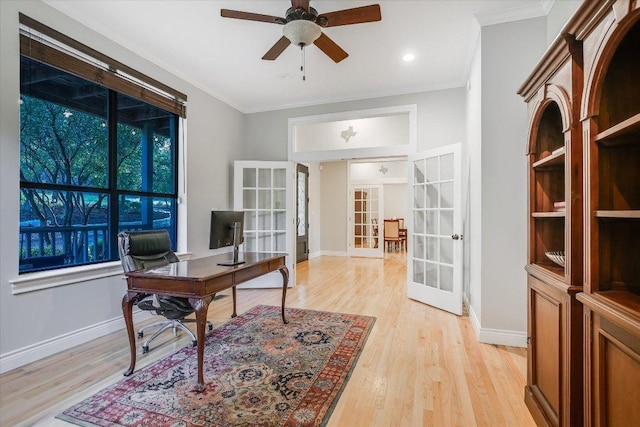 office featuring baseboards, ceiling fan, and french doors