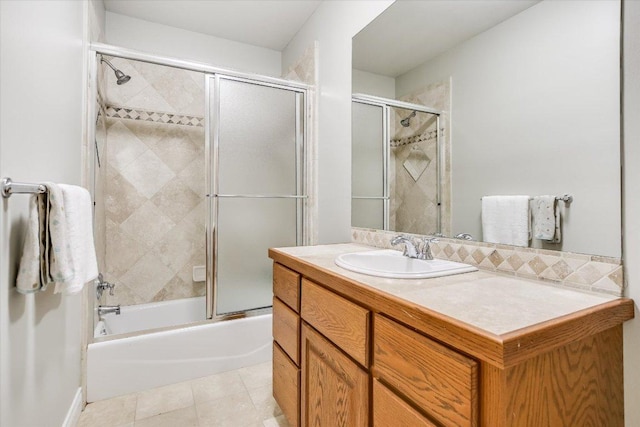 277 S Commons Ford Rd, Austin, TX 78733 - bathroom featuring vanity, shower / bath combination with glass door, and tile patterned flooring
