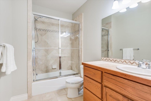 full bathroom with toilet, tile patterned floors, combined bath / shower with glass door, and vanity