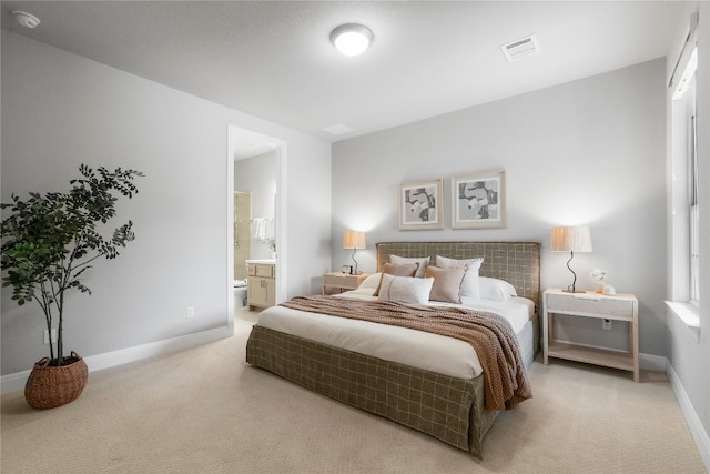 2033 Portobello Rd, Leander, TX 78641 - bedroom with carpet floors, baseboards, and ensuite bathroom