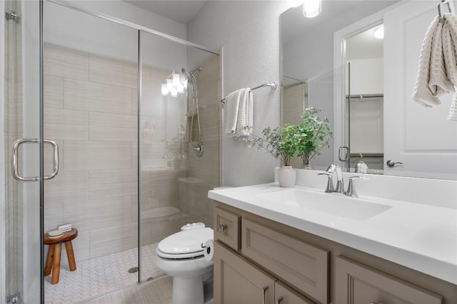 2033 Portobello Rd, Leander, TX 78641 - bathroom featuring toilet, vanity, and a shower stall