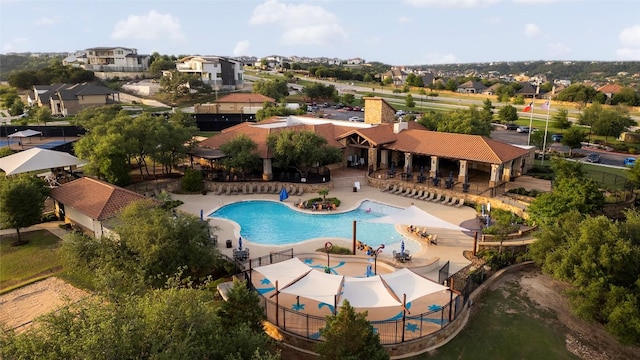 2033 Portobello Rd, Leander, TX 78641 - community pool with a residential view and a patio area