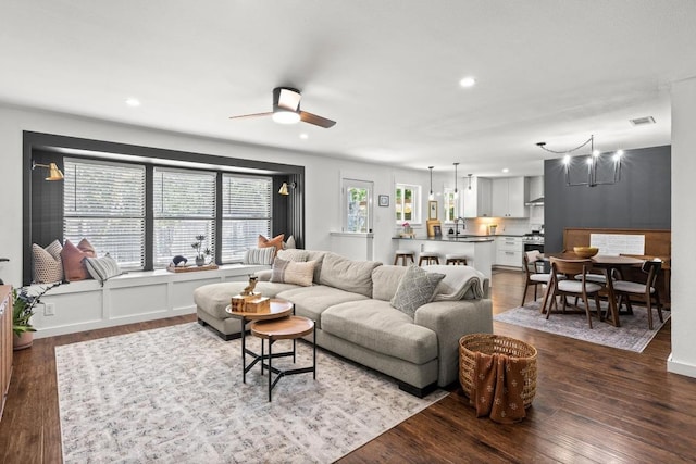 living room with recessed lighting, ceiling fan, dark wood-style floors, and visible vents