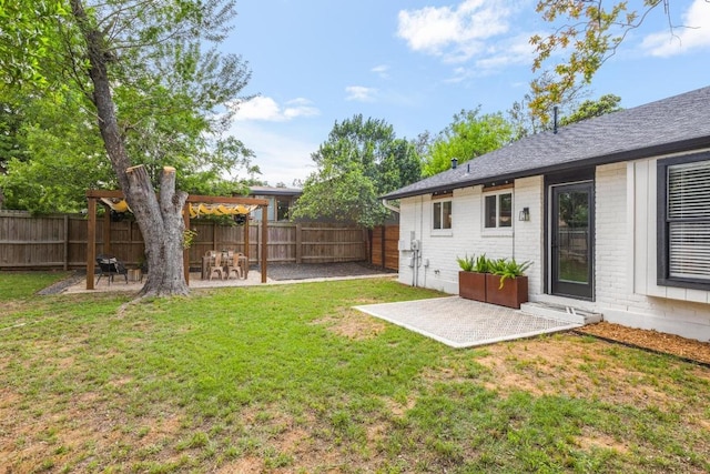 view of yard with a fenced backyard and a patio area