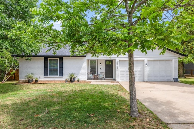 ranch-style home featuring a garage, a front lawn, covered porch, brick siding, and concrete driveway
