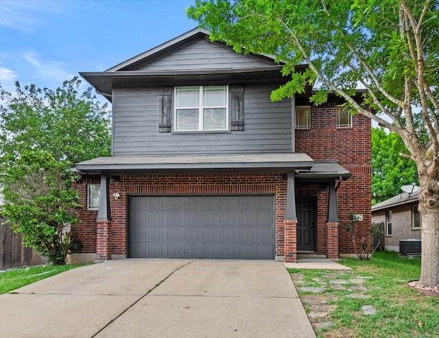 traditional home featuring a garage, concrete driveway, central AC, and brick siding