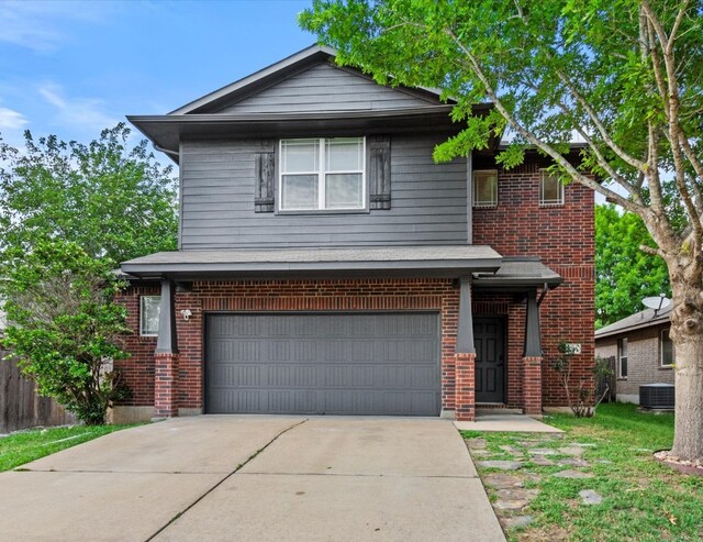 1728 Strobel Ln, Austin, TX 78748 - view of front of home featuring an attached garage, concrete driveway, and brick siding