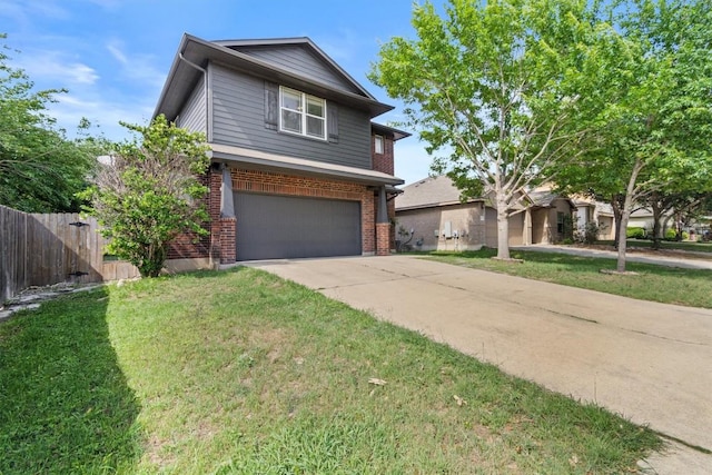view of front of house featuring a garage, fence, a front yard, and brick siding