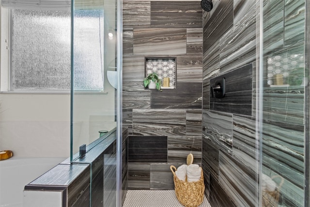 full bathroom featuring tiled shower