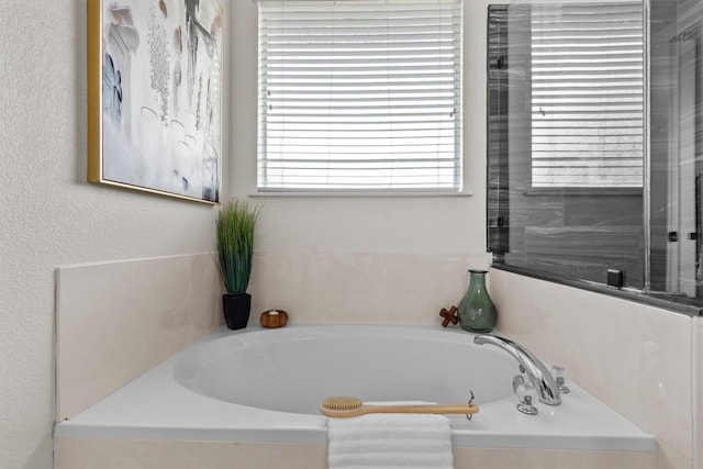 bathroom featuring a garden tub
