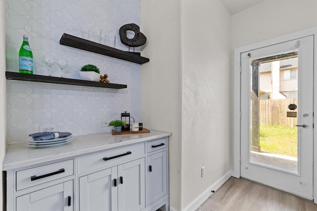 1728 Strobel Ln, Austin, TX 78748 - bar area with light wood finished floors and baseboards