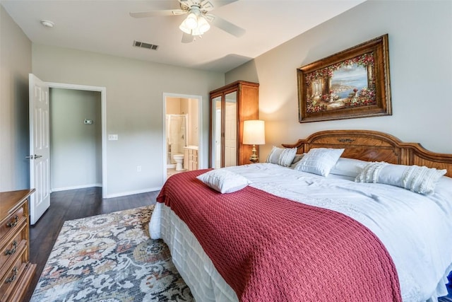 bedroom featuring visible vents, baseboards, ensuite bathroom, ceiling fan, and dark wood finished floors