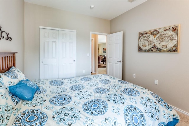 carpeted bedroom featuring a closet