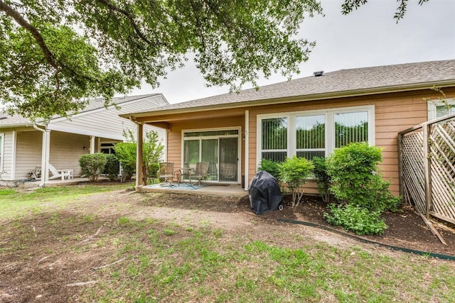 rear view of property with a patio