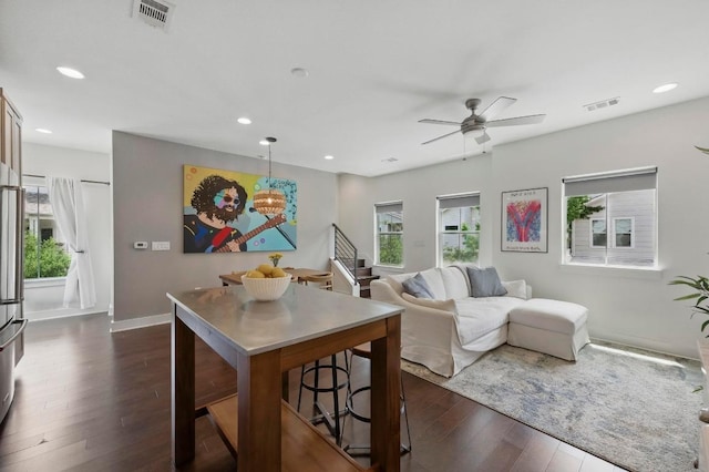 living room with recessed lighting, a ceiling fan, dark wood-style flooring, and visible vents