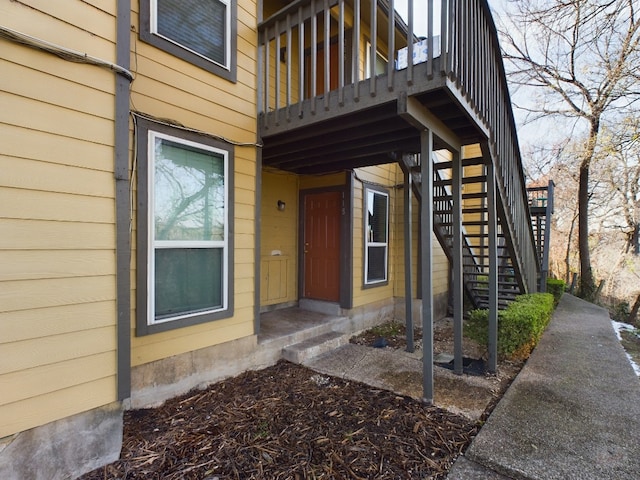 view of exterior entry featuring a deck