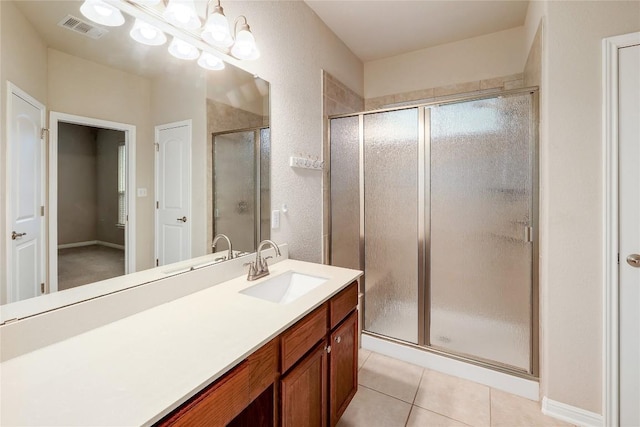 3451 Mayfield Ranch Blvd Unit 369, Round Rock, TX 78681 - bathroom with a stall shower, vanity, and tile patterned floors