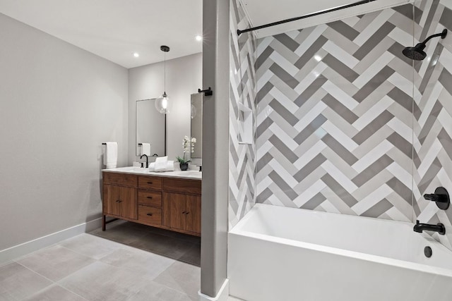 bathroom with double vanity, a sink, tile patterned floors, baseboards, and  shower combination