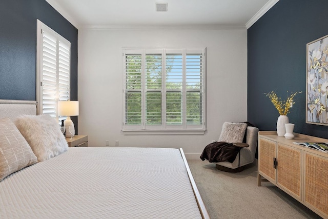 bedroom featuring ornamental molding, carpet, and multiple windows