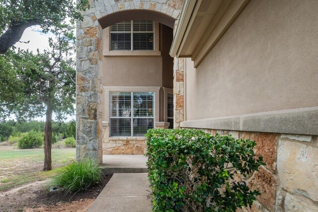 7901 SW Pkwy Unit 16, Austin, TX 78735 - property entrance with stone siding and stucco siding
