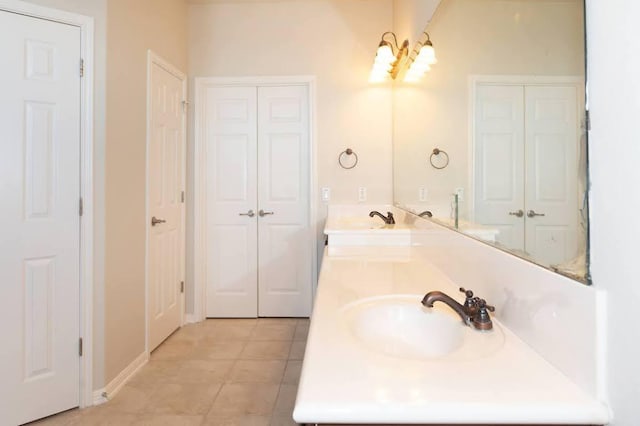 7901 SW Pkwy Unit 16, Austin, TX 78735 - full bathroom with double vanity, a closet, and tile patterned flooring