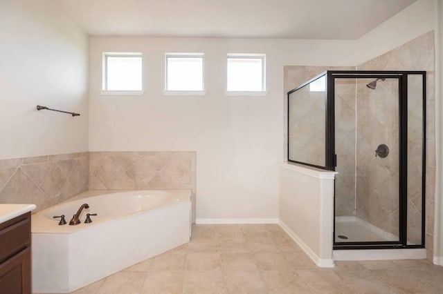 7901 SW Pkwy Unit 16, Austin, TX 78735 - bathroom featuring vanity, a bath, plenty of natural light, and a shower stall