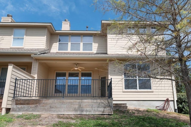 7901 SW Pkwy Unit 16, Austin, TX 78735 - back of house featuring a chimney and covered porch