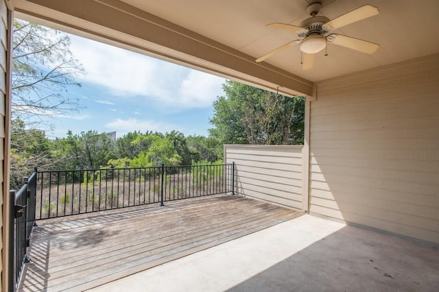 view of patio featuring a ceiling fan and a balcony