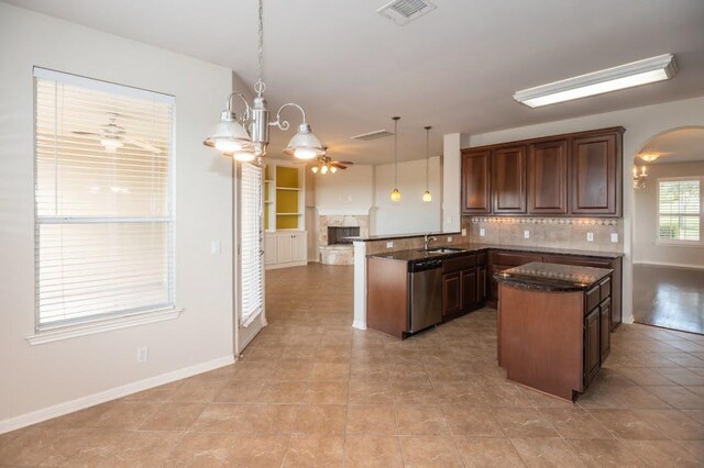 7901 SW Pkwy Unit 16, Austin, TX 78735 - kitchen with dishwasher, a peninsula, open floor plan, tasteful backsplash, and ceiling fan