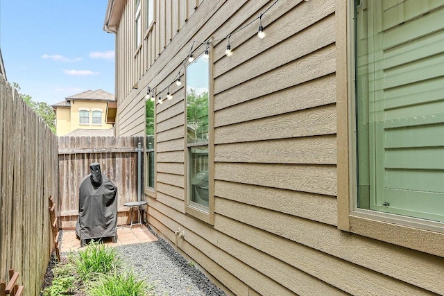 view of side of property with fence