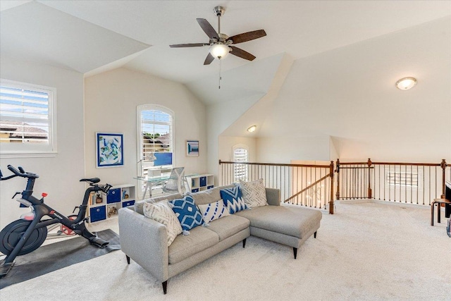 living area with carpet, a ceiling fan, and lofted ceiling