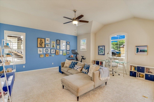 carpeted living area with ceiling fan, vaulted ceiling, and baseboards