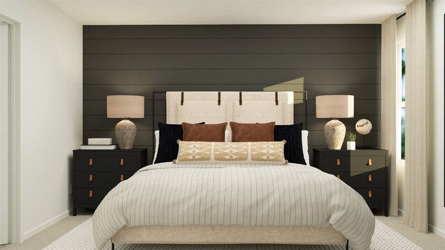 bedroom with baseboards and light carpet