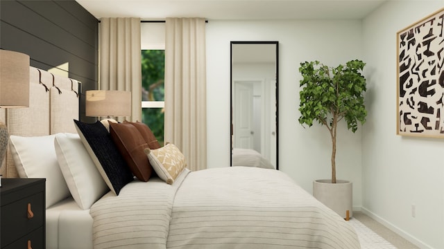 carpeted bedroom featuring baseboards