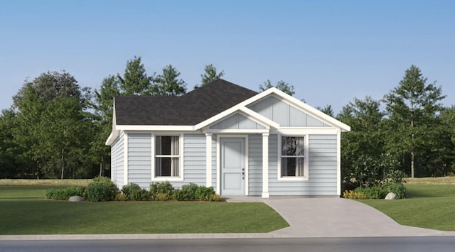 view of front of property featuring board and batten siding and a front lawn
