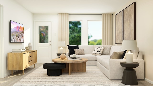 sitting room featuring baseboards and light wood-type flooring