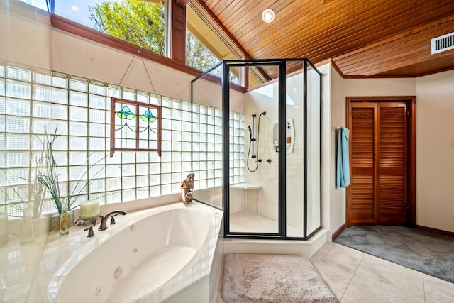 bathroom featuring tile patterned floors, a tub with jets, wooden ceiling, lofted ceiling, and a stall shower