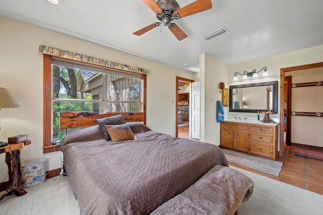 bedroom with visible vents and light tile patterned floors
