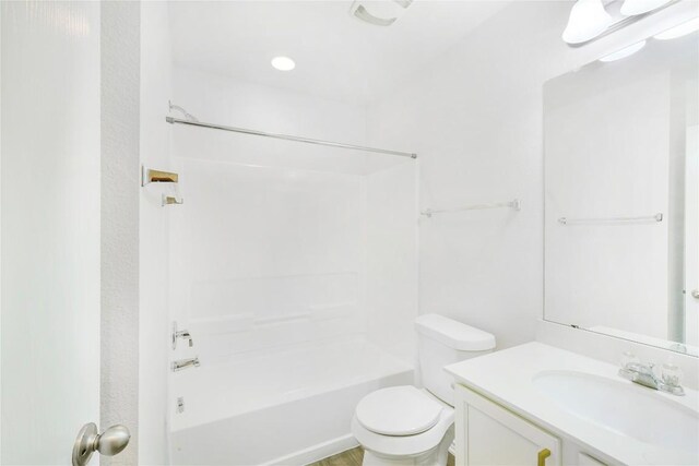 bathroom featuring vanity, toilet, and tub / shower combination